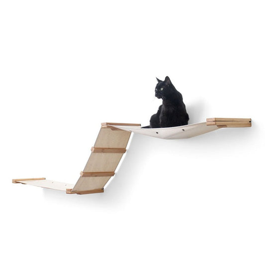 Black cat on wall-mounted cat tree.
