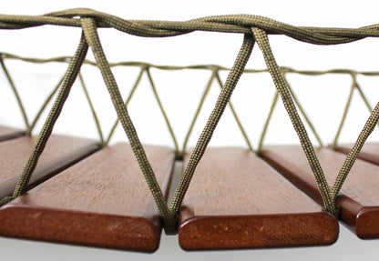 Wooden slats connected by rope.