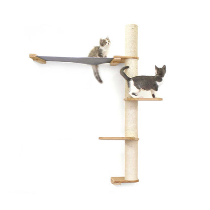 Tall cat perch with vertical onyx bamboo scratching poles, natural canvas summit hammock, and tiered platforms for climbing.